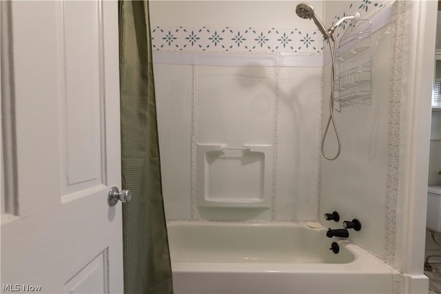 bathroom featuring shower / bathtub combination with curtain