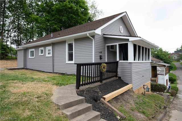 view of front of home with a sunroom