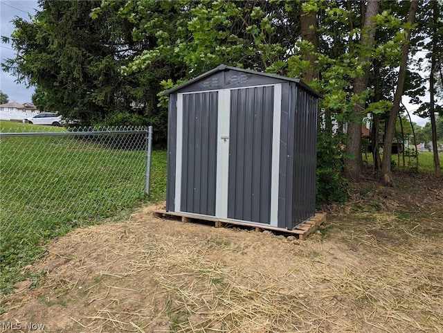 view of outbuilding with a lawn