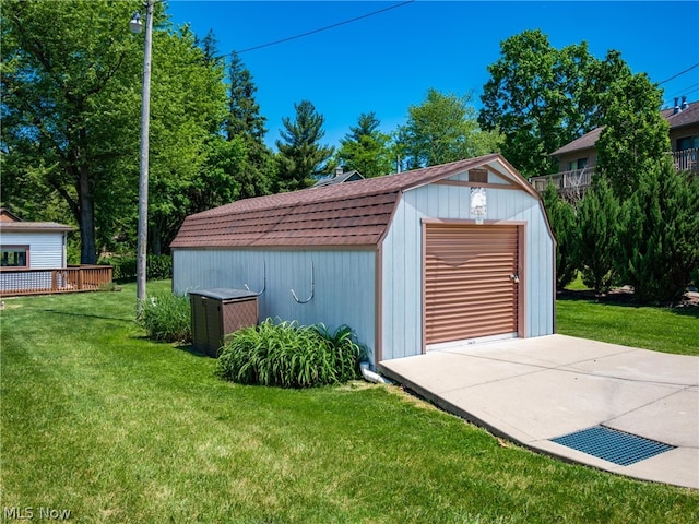 garage with a lawn