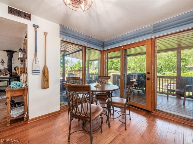 sunroom featuring a wood stove