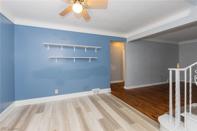 spare room featuring ceiling fan and hardwood / wood-style floors