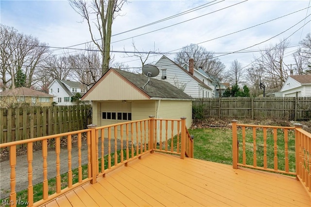 deck with a yard and an outbuilding