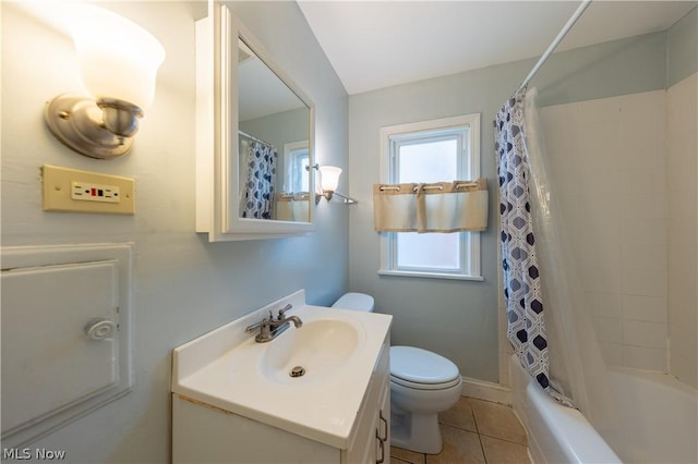 full bathroom featuring tile patterned flooring, vanity, toilet, and shower / bathtub combination with curtain