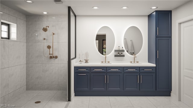 bathroom featuring a tile shower, dual vanity, and tile floors