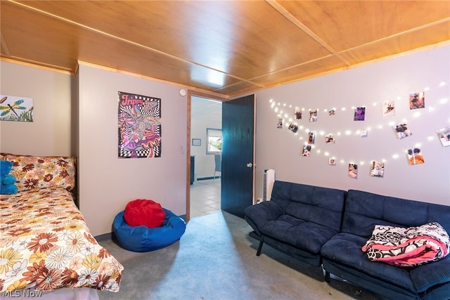 bedroom featuring tile floors, radiator heating unit, and wood ceiling