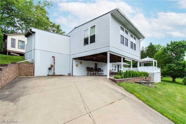 6579 Camp Blvd, Hanoverton, OH 44423 - view of front of house with a front yard, driveway, a carport, and a patio area