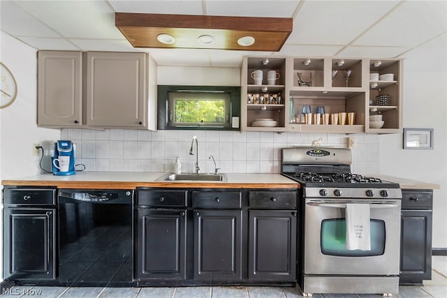 kitchen with stainless steel gas range oven, dishwasher, tasteful backsplash, and light tile floors