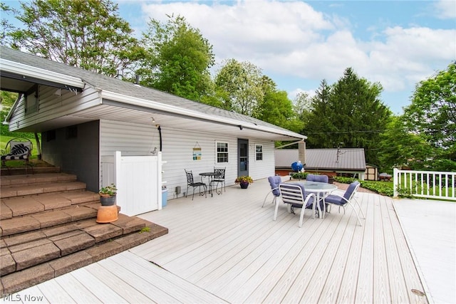 6579 Camp Blvd, Hanoverton, OH 44423 - wooden terrace featuring outdoor dining area