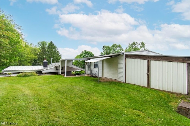 6579 Camp Blvd, Hanoverton, OH 44423 - rear view of property with a yard and a garage