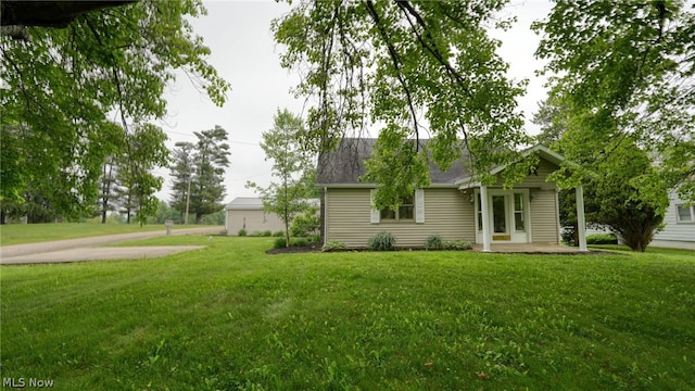 view of front of property featuring a garage and a front lawn