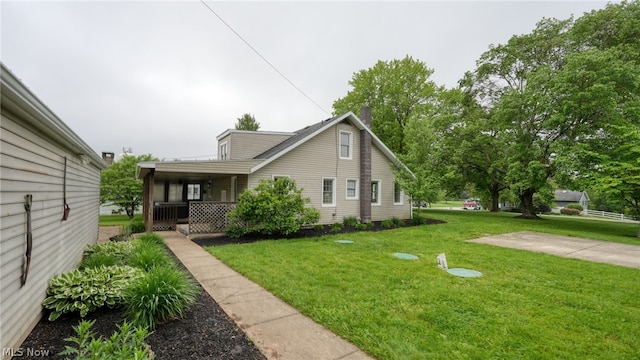 exterior space featuring a front yard and covered porch