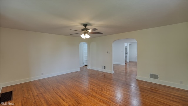 spare room with ceiling fan and hardwood / wood-style floors