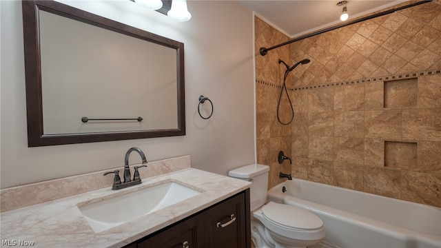 full bathroom with vanity, toilet, and tiled shower / bath combo