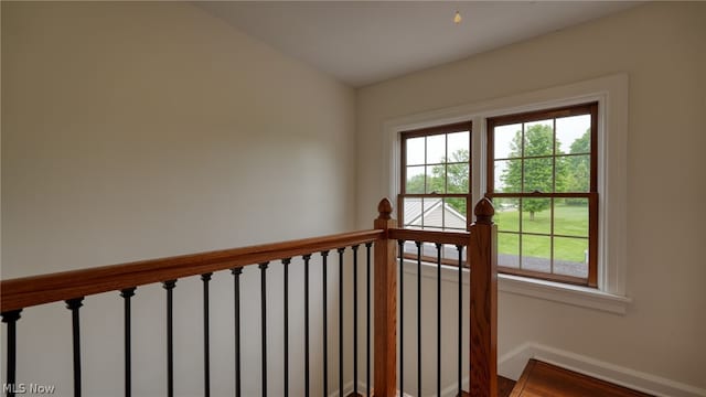 stairs with wood-type flooring