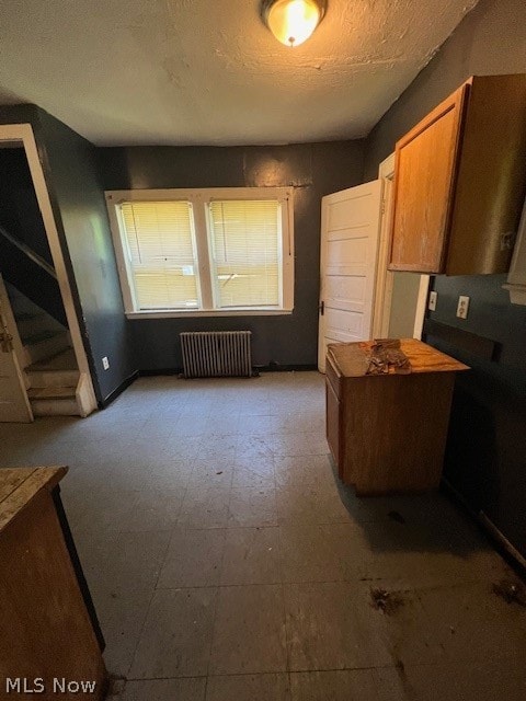 kitchen featuring kitchen peninsula and radiator