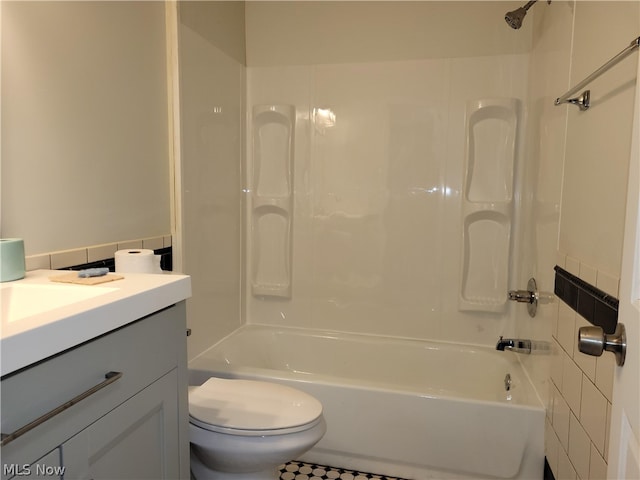 full bathroom featuring vanity, shower / bath combination, and toilet