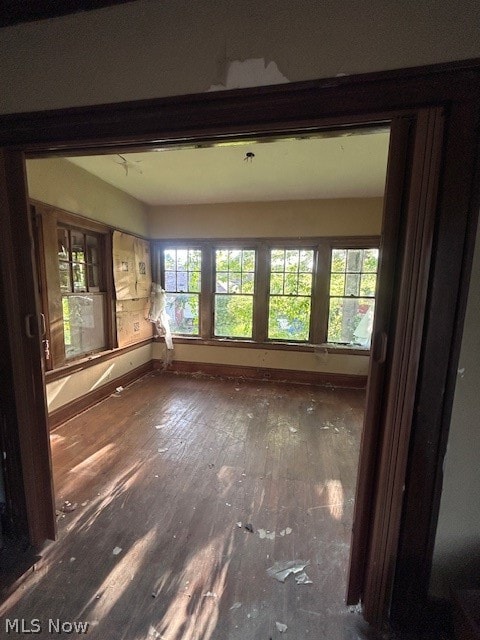 unfurnished living room with hardwood / wood-style floors