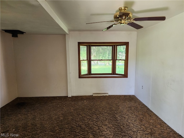 spare room with carpet and ceiling fan