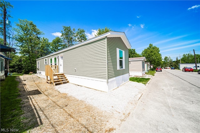 view of home's exterior featuring gravel driveway