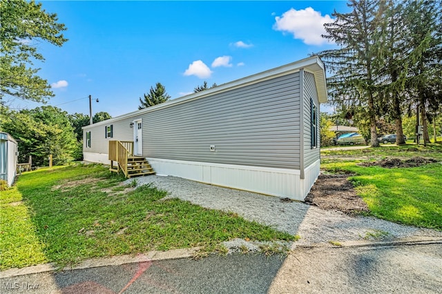 view of home's exterior featuring a yard