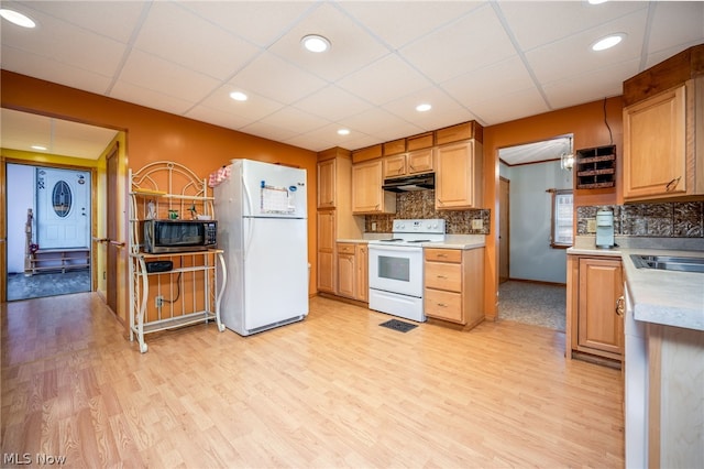 kitchen with white appliances, tasteful backsplash, a paneled ceiling, and light hardwood / wood-style flooring