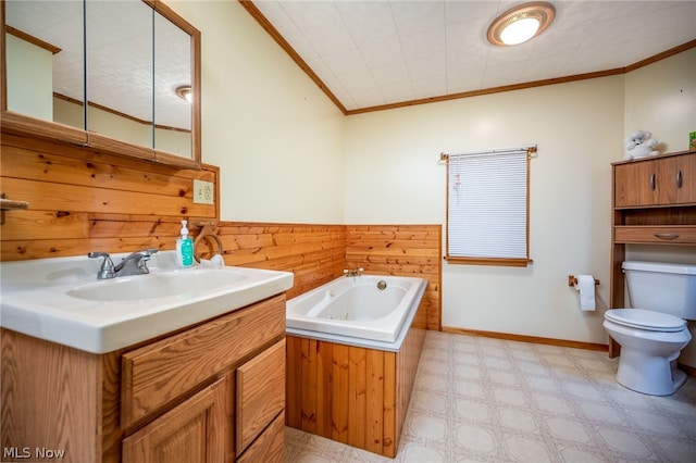 bathroom with a bathing tub, toilet, tile floors, ornamental molding, and vanity