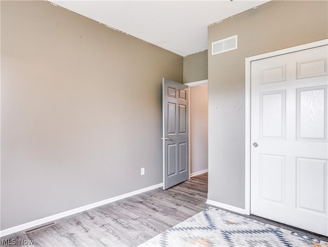 unfurnished bedroom featuring light wood-type flooring