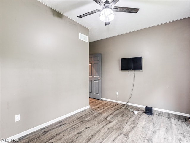 spare room featuring ceiling fan and light wood-type flooring