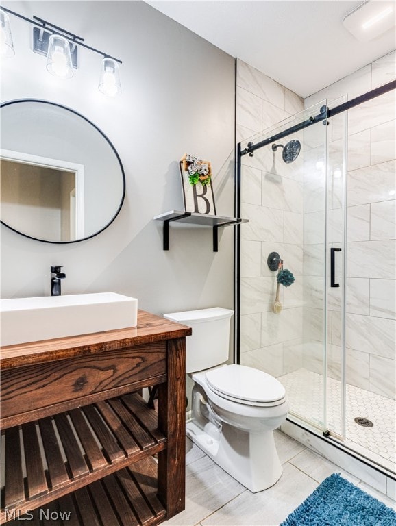 bathroom featuring toilet, vanity, a baseboard radiator, and walk in shower