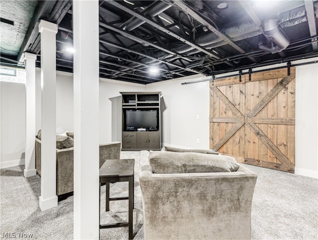 unfurnished living room with carpet flooring and a barn door