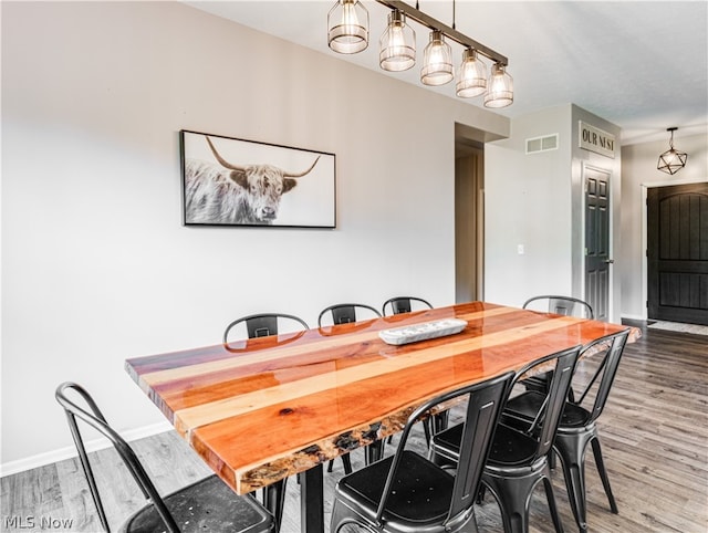 dining area featuring wood-type flooring