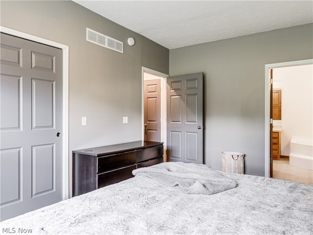 bedroom with ensuite bath