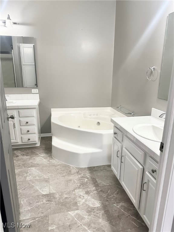 bathroom with a bathtub and vanity