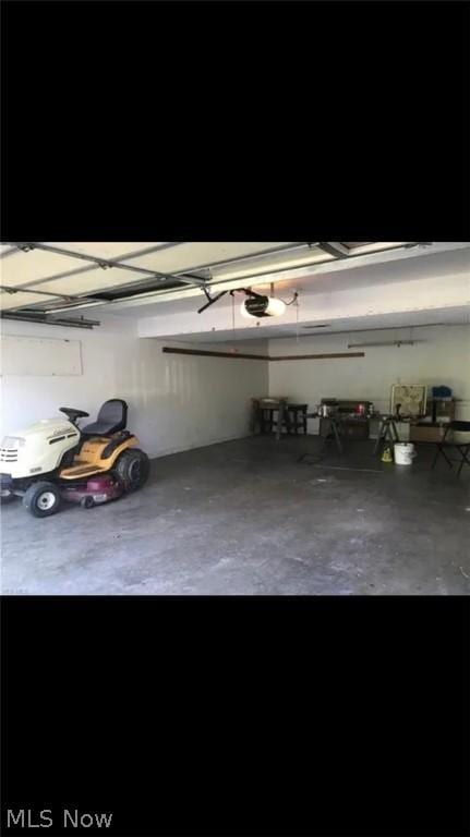 garage featuring a garage door opener