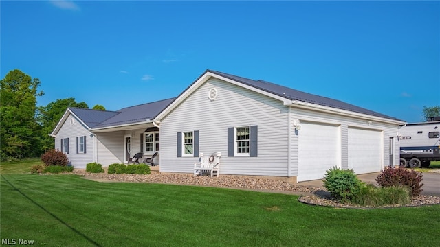 single story home featuring a garage and a front lawn