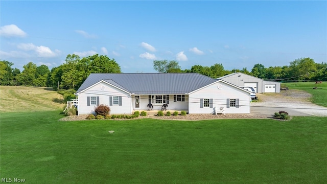 ranch-style home featuring a front yard, a porch, and a garage