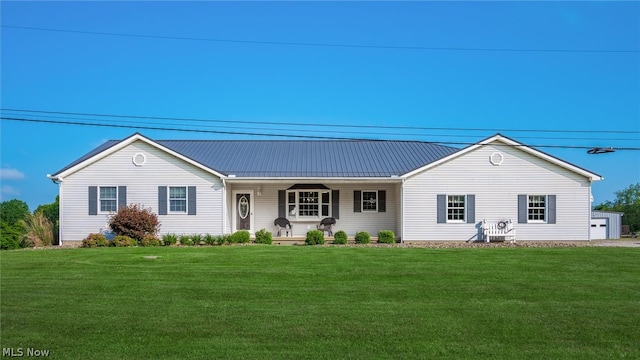 ranch-style home featuring a front yard