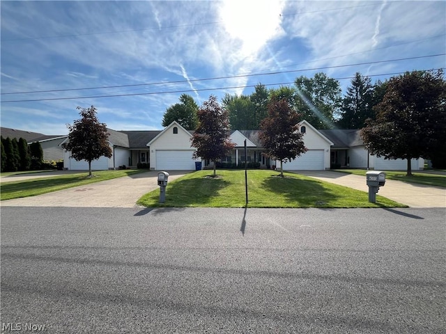 view of front facade featuring a garage and a front lawn