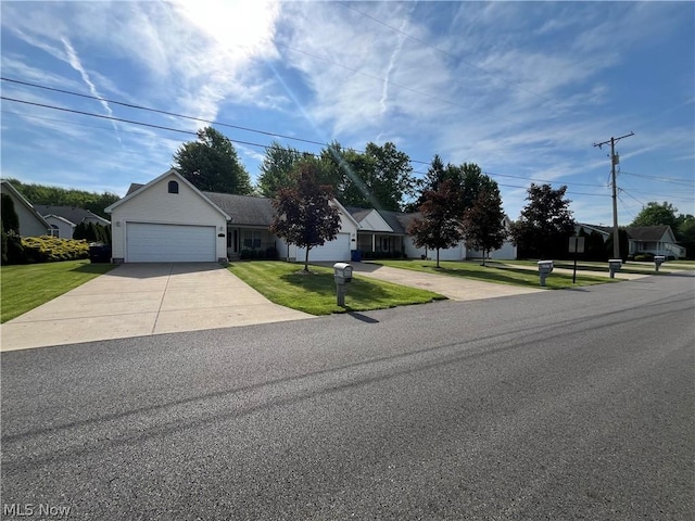 view of front facade with a garage and a front lawn