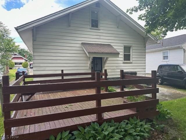 view of side of home with a deck