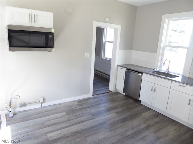 kitchen with white cabinets, sink, dark wood-type flooring, and appliances with stainless steel finishes