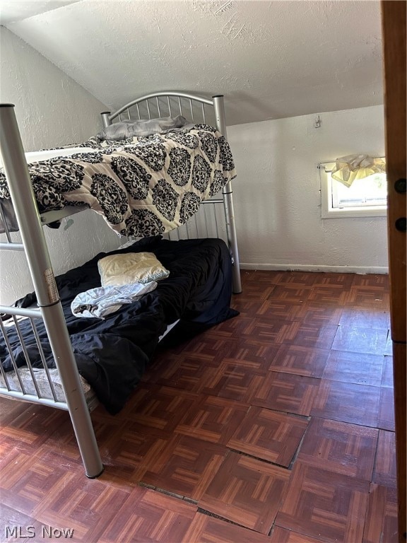 bedroom featuring vaulted ceiling