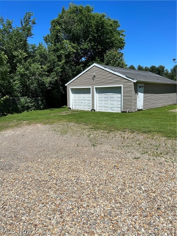 garage with a lawn