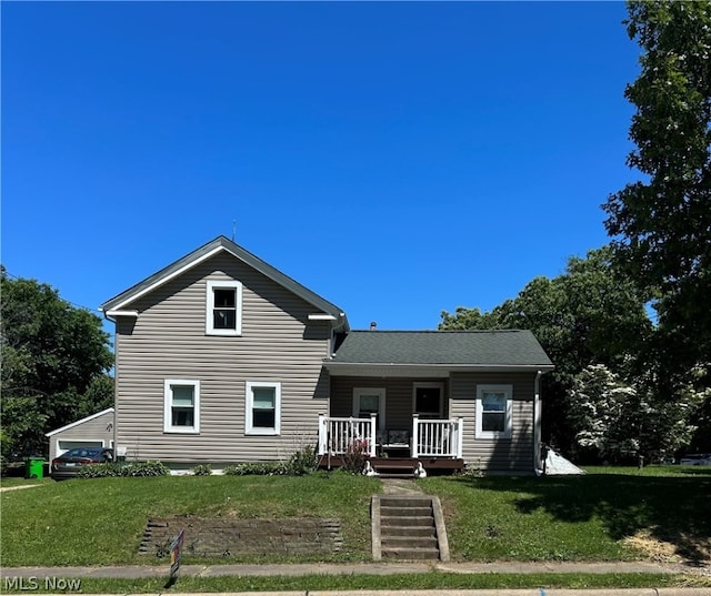 view of front facade with a porch and a front lawn