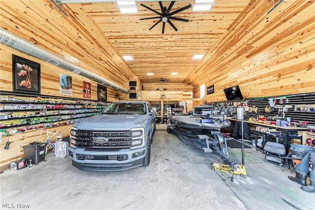 garage with a workshop area and ceiling fan