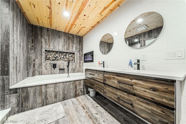 bathroom featuring wooden ceiling, hardwood / wood-style floors, wood walls, and vanity