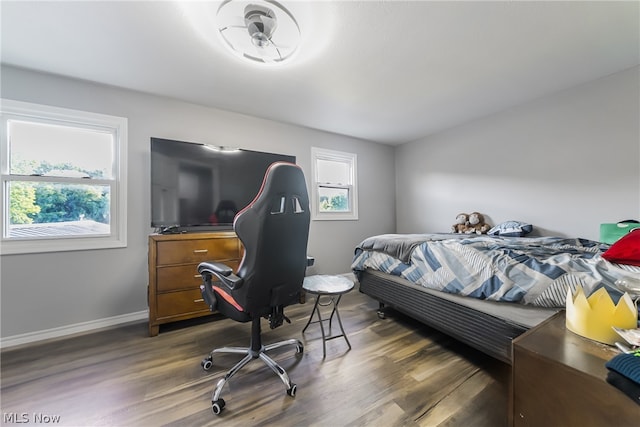 bedroom featuring dark hardwood / wood-style flooring