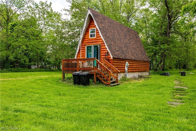 rear view of property with a yard