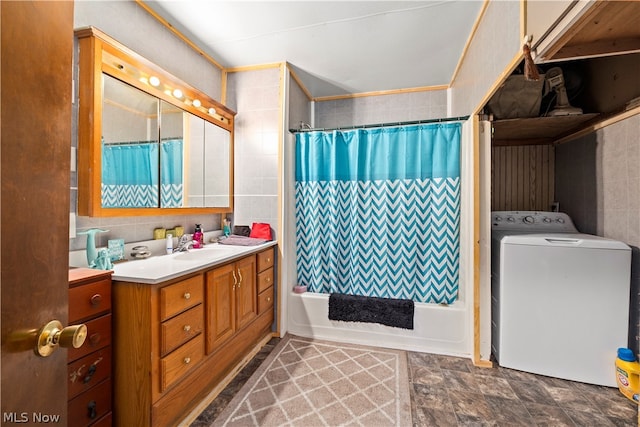 bathroom with tile flooring, washer / dryer, vanity, and shower / tub combo with curtain